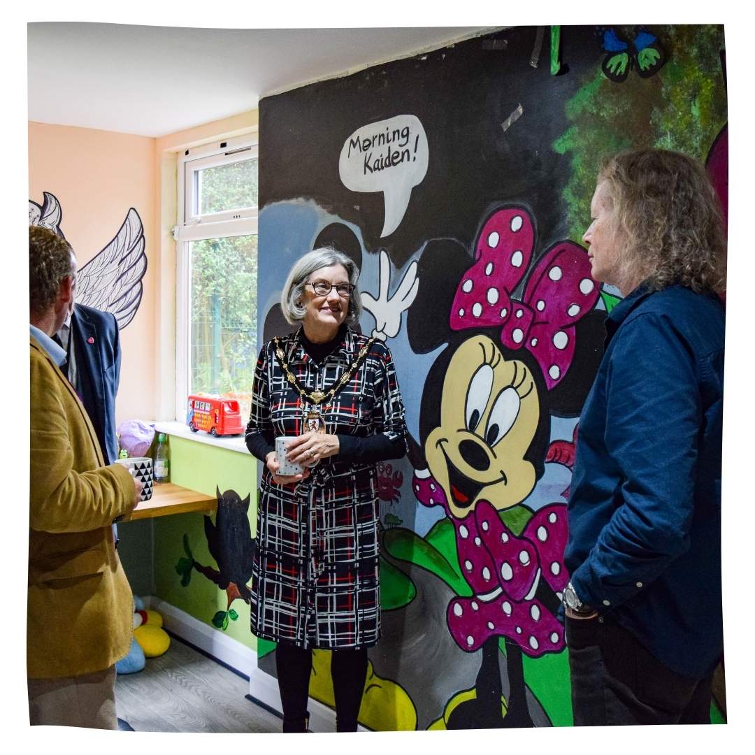 Kevin showing one of the young people's rooms to the Lord Mayor