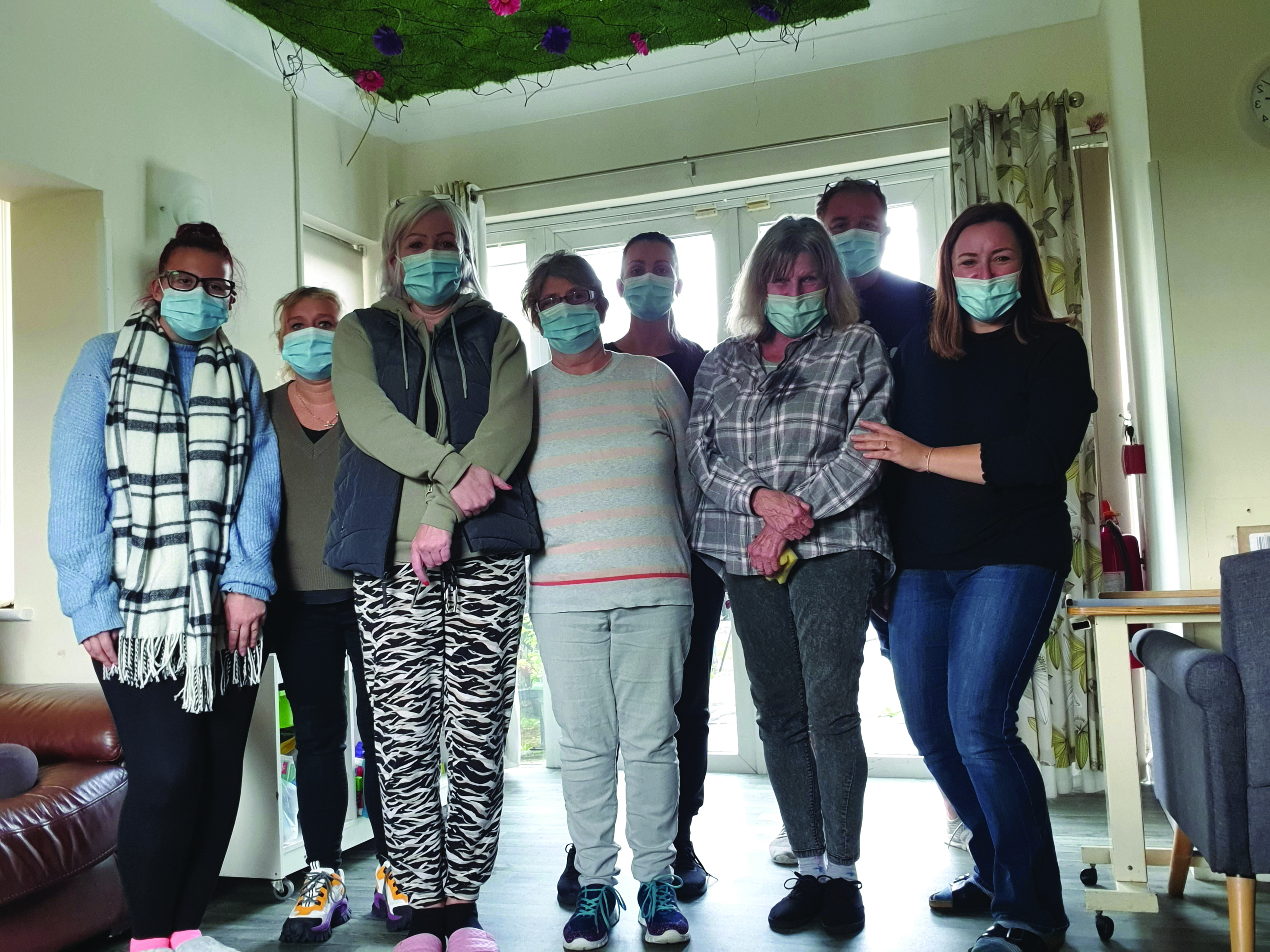 Together trust staff wearing face masks