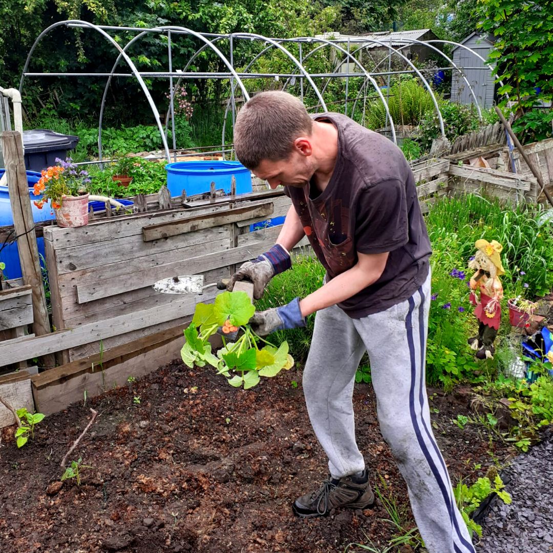 The young person's dad looking after the garden 