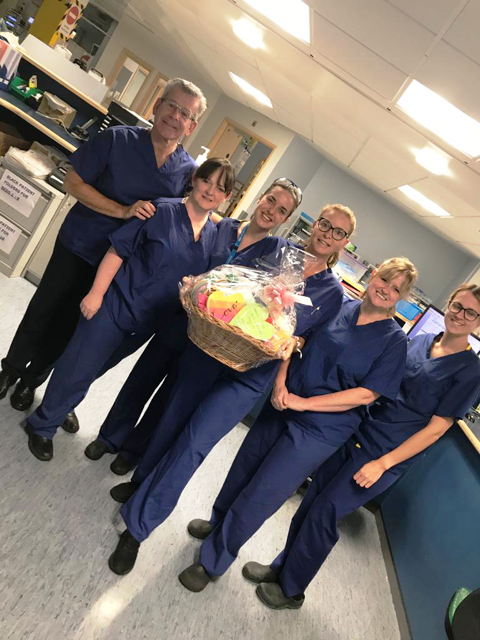 Staff at the ICU at Wythenshawe Hospital with the hearts created for them by children at Ashcroft School