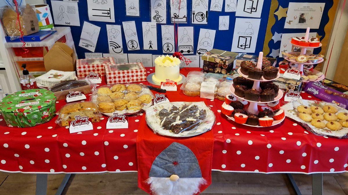 A photo of the cakes stall - muffins, scons, lemon cake, mince pies and more