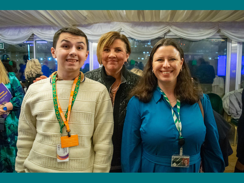 Mother Rebecca and son Joshua, who spoke at the event about their transitions experience, stood with MP Sarah Russell.