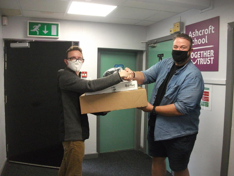 Oliver Hague (on the left) presenting the prize to Andy Jones (on the right) - the teacher, who supported the students with their competition entries. 