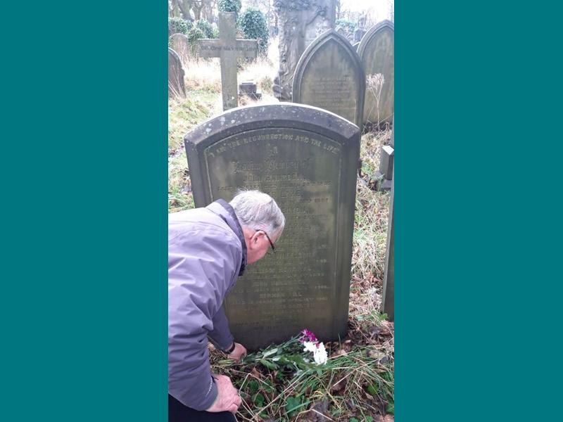 Together Trusts Chairman Ralph Ellerton lays flowers on the graves of Leonard Shaw and his wife Annie, along with some of the children who died in our homes. . 