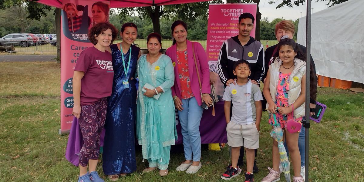 Together Trust team and visitors at the festival. Together Trust team and visitors at the festival.