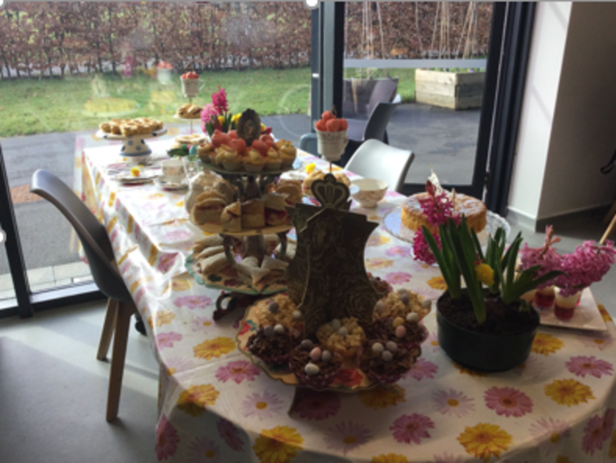 A dressed table with easter decorations and cakes A dressed table with easter decorations and cakes