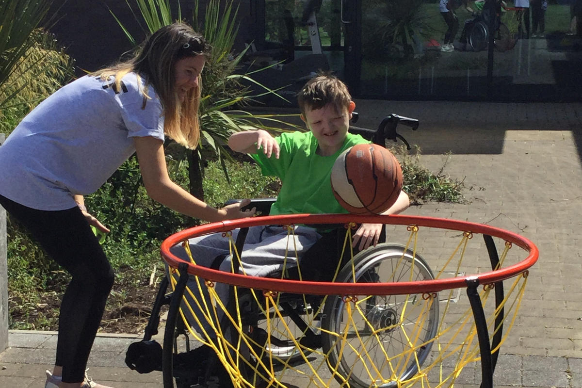 Bridge College student playing wheelchair basketball