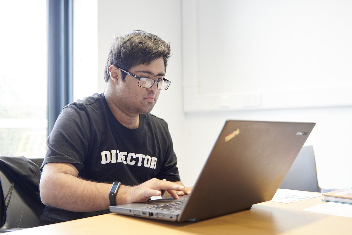 a bridge student working on a computer
