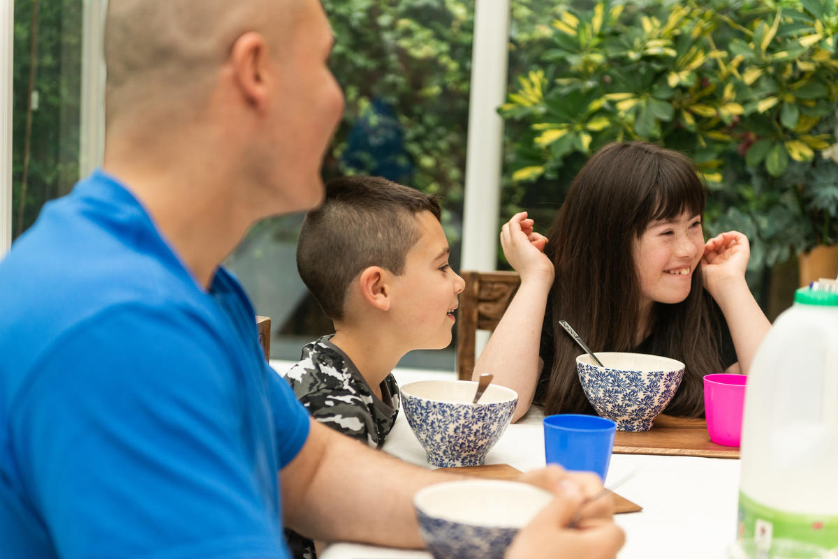 Photo of a family eating breakfast together