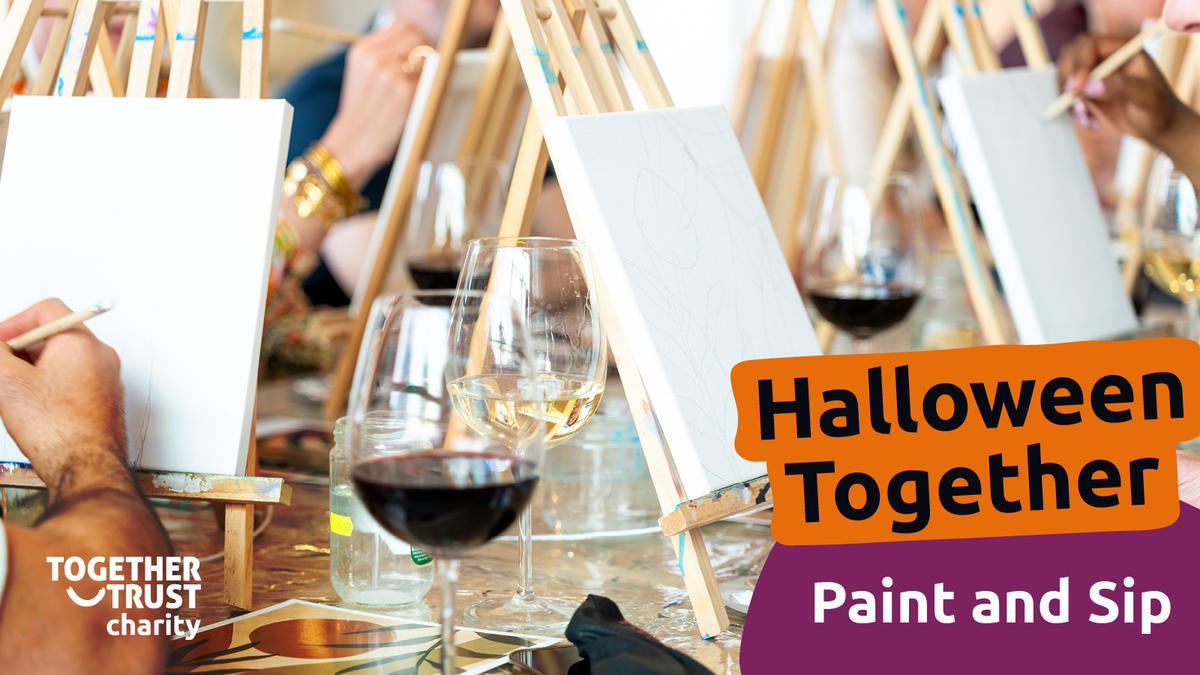 a group of people painting on canvas with glasses of wine next to them