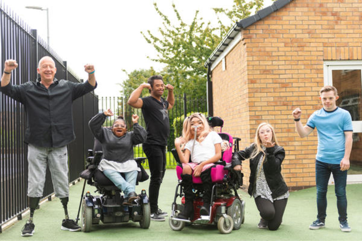 A group of people smiling at the camera 