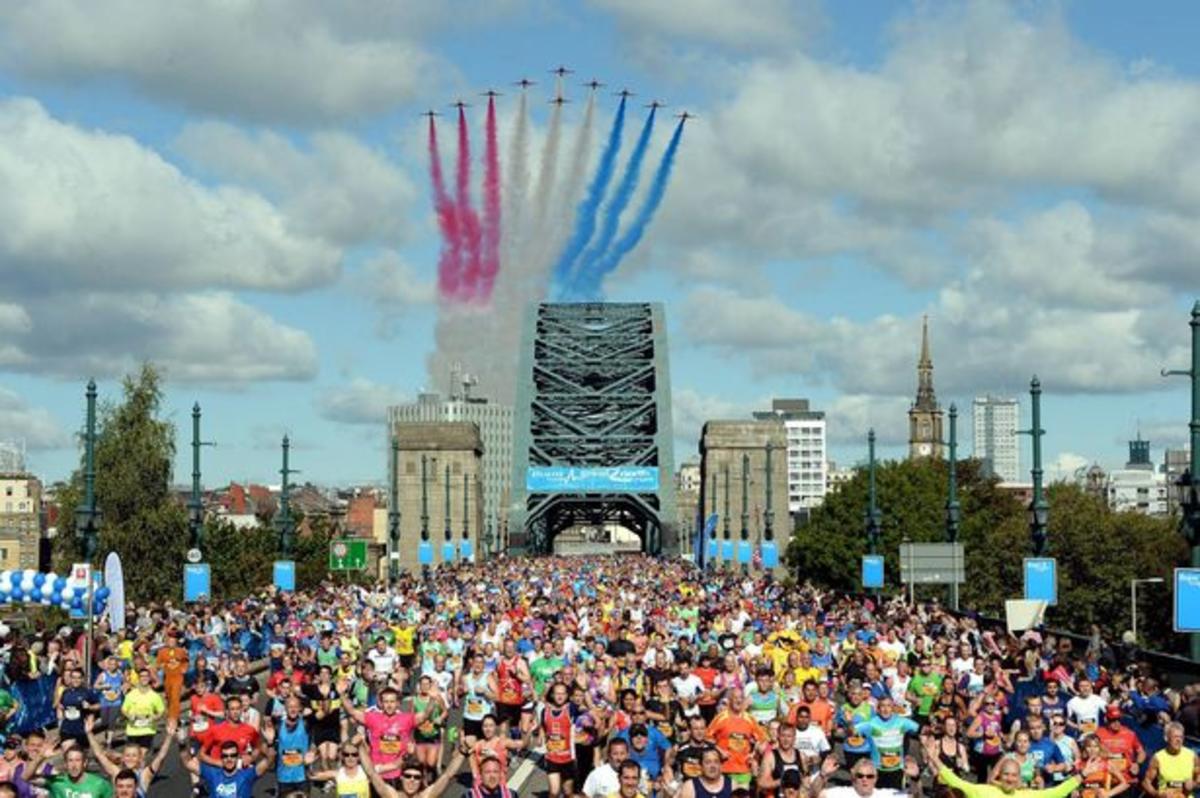 A group of runners with the red arrows flying overhead