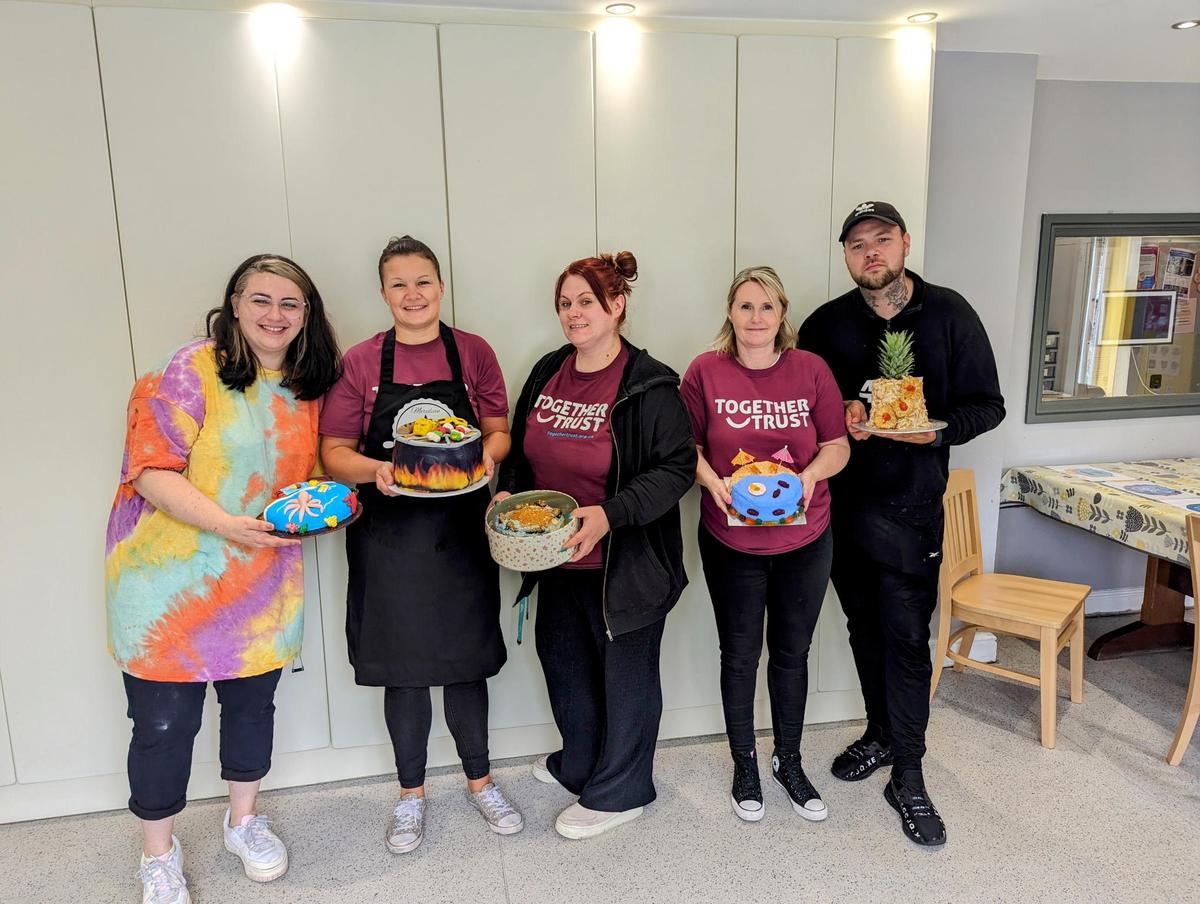 The team members from Meridian posing for a photo along with some of their culinary masterpieces. The team members from Meridian posing for a photo along with some of their culinary masterpieces.