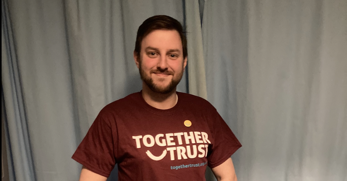 A headshot of Daniel in a Together Trust t-shirt