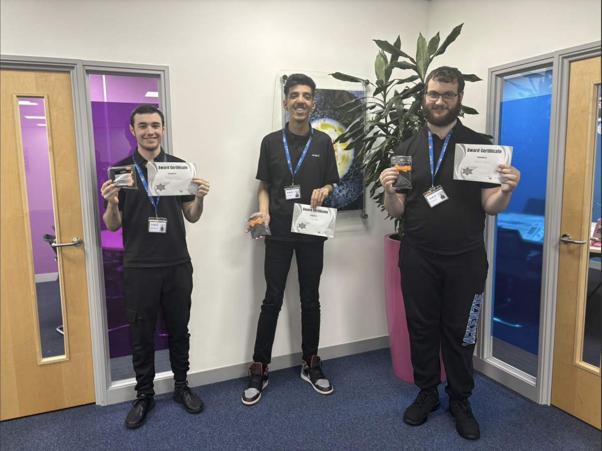 three supported internship students smiling holding certificates