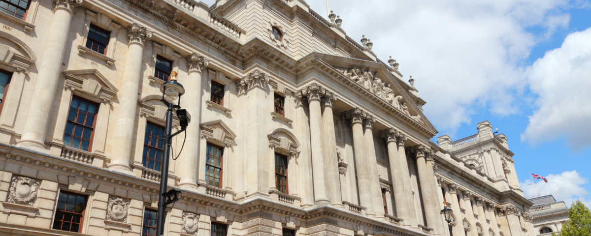 A side view of the regal HM Treasury building in London.