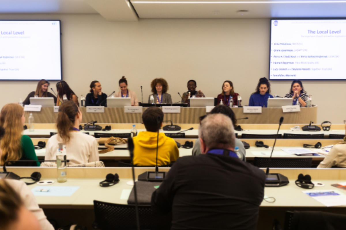 a panel of people at an event