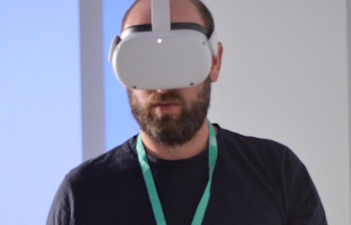 A photo of Jeremy, Assistive Technologist, testing the VR equipment 