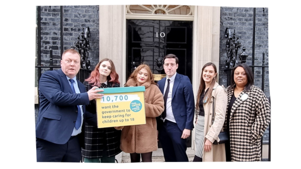 Keep Caring to 18, 10 Downing Street Petition hand in A group of 6 care leavers of various ages and ethnicities holding a petition box in front of 10 Downing Street. The box reads "10,700 want the government to keep caring for children up to 18"