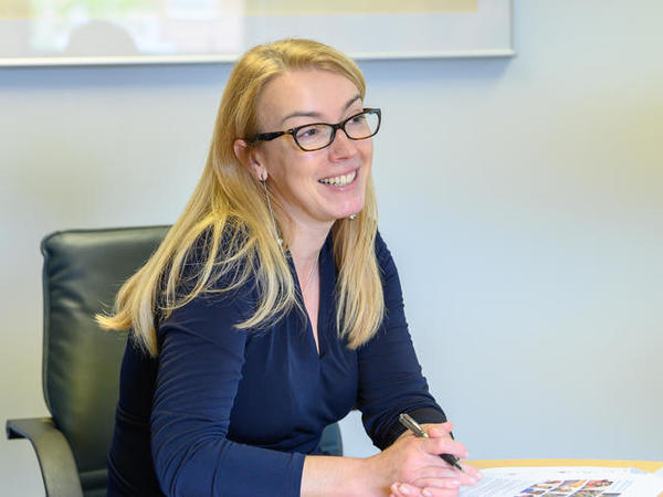 A image of a female member of staff smiling A image of a female member of staff smiling