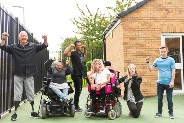 A group of people cheering and celebrating