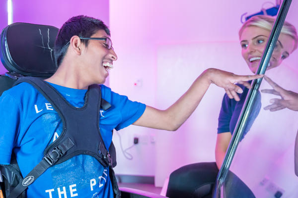 Student in wheelchair in a therapy session