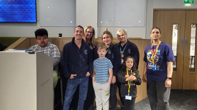 Group photo in an office space of 2 Inscape students, 4 staff members and Rabia from Barclays and her daughter. 