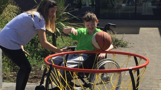 Bridge College student playing wheelchair basketball