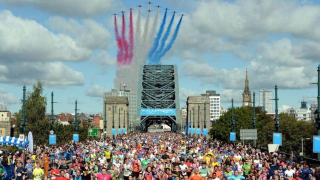 A group of runners with the red arrows flying overhead