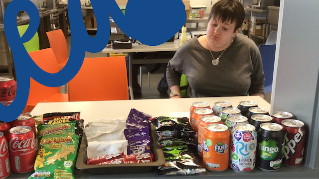 student selling snacks in the college tuck shop