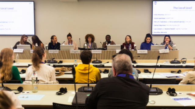 a panel of people at an event