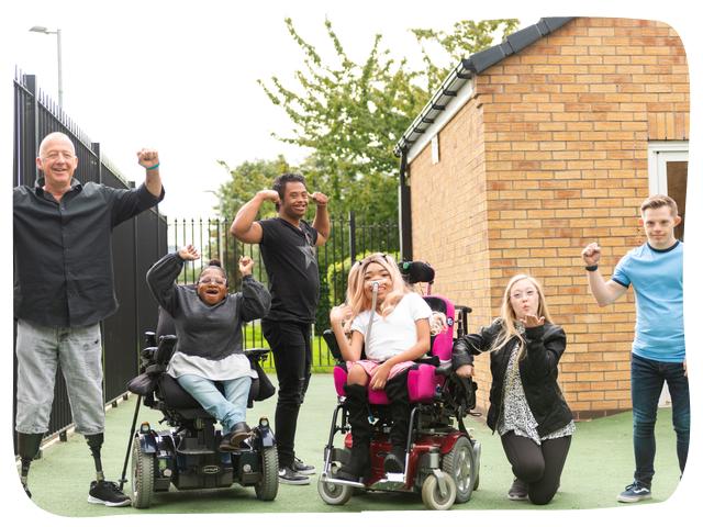 A group of people cheering and celebrating